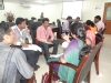 Participants actively participating in group discussion.